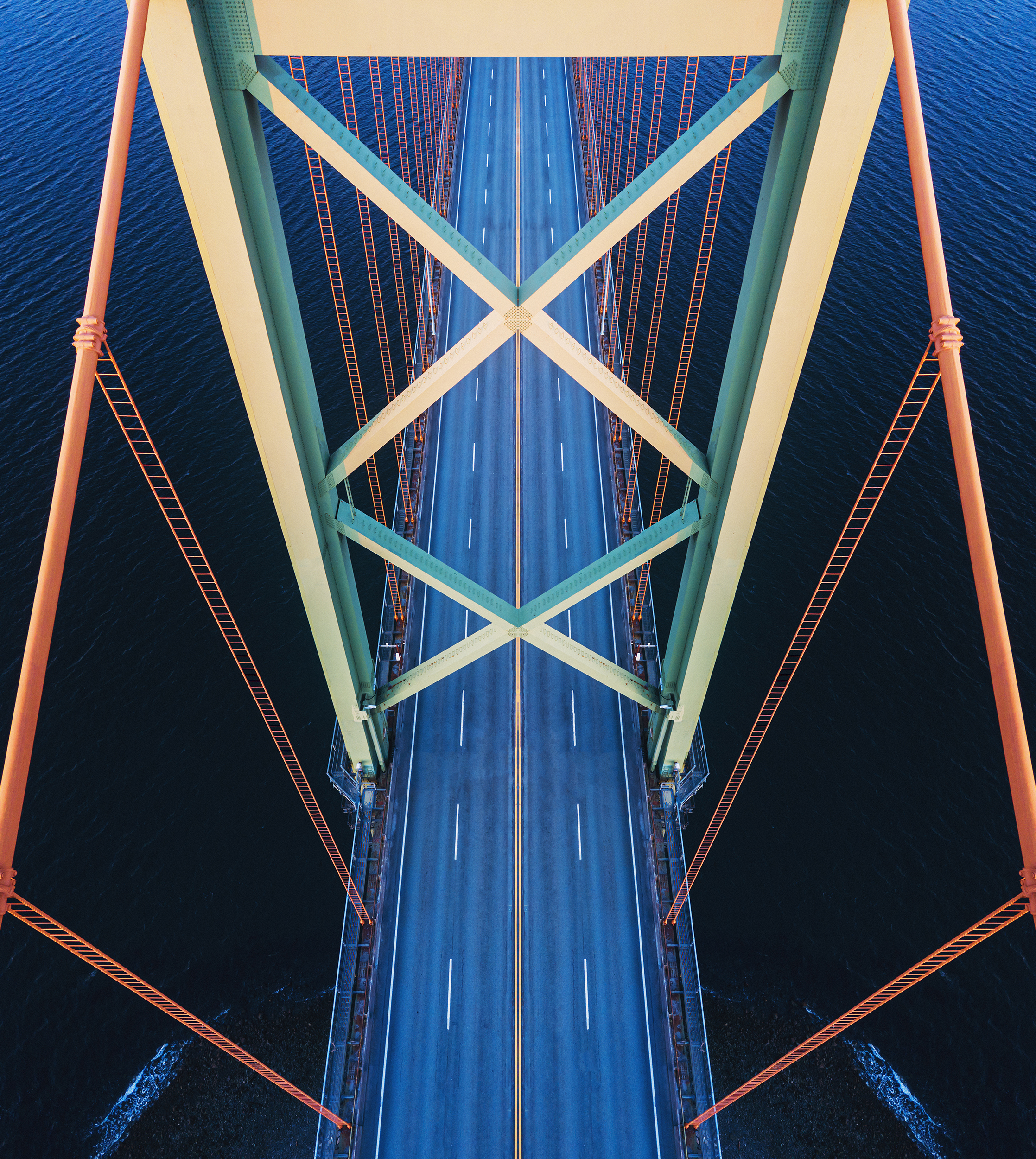 Aerial drone view of the A. Murray MacKay Bridge spanning Halifax Harbour.  Symmetrical composite.