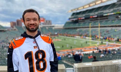 Young man at NFL football game 